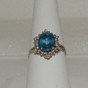 BEAUTIFUL 14K DARK BLUE TOPAZ SURROUNDED BY DIAMONDS